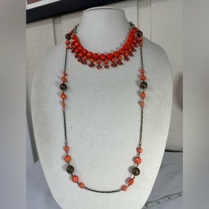 Two orange statement necklaces